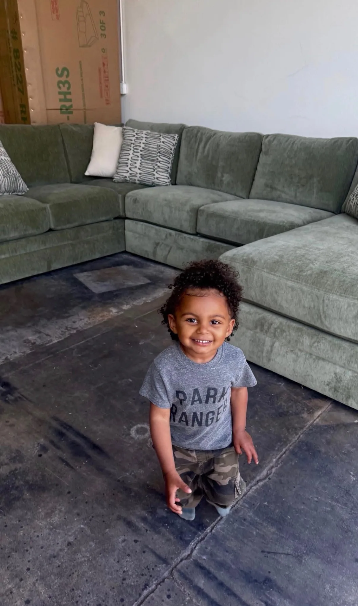 Custom olive green sectional in a family home
